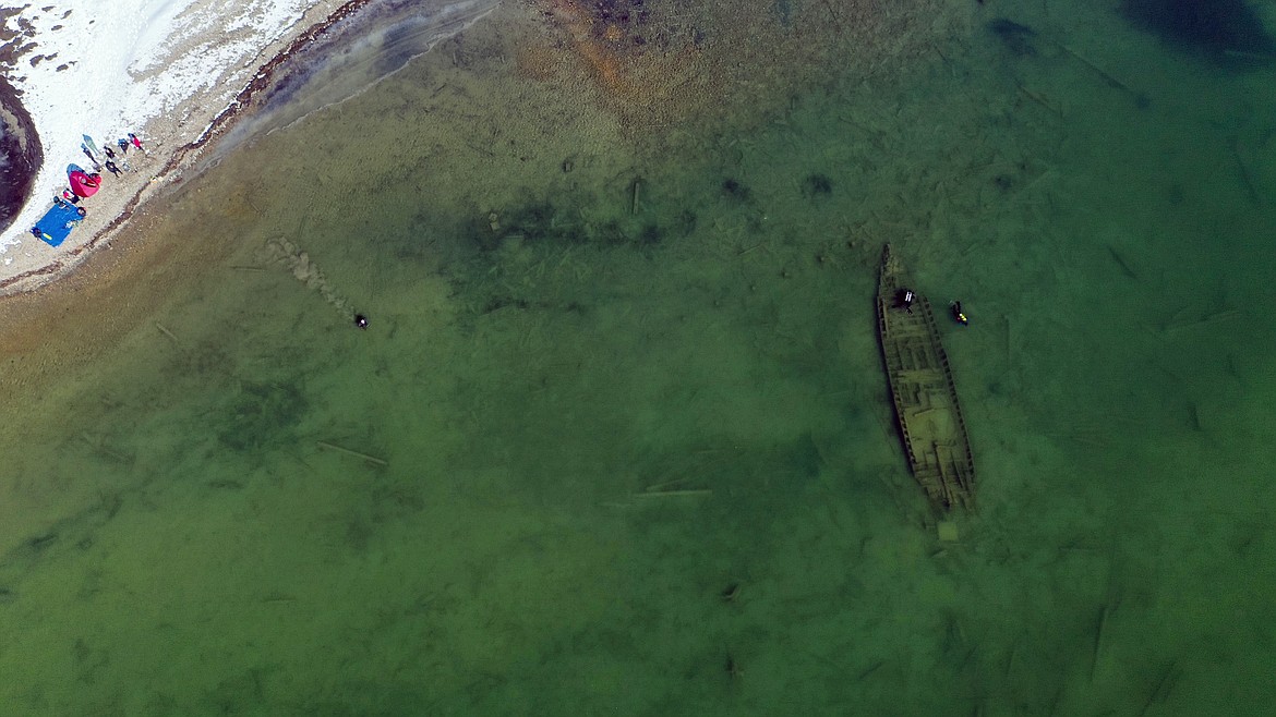 Divers Brian Nadwidny, John Pollack, and Chris McNaughton are pictured charting the wreck of an old steamship that was recently discovered in the region for the Bonner County Museum.