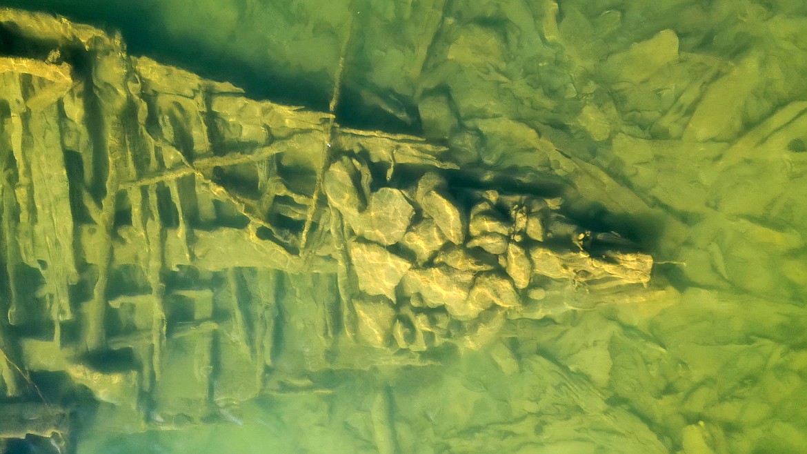 Large stones likely used to scuttle an old steamship are pictured at the front of the bow after the wreck was discovered recently in the area.