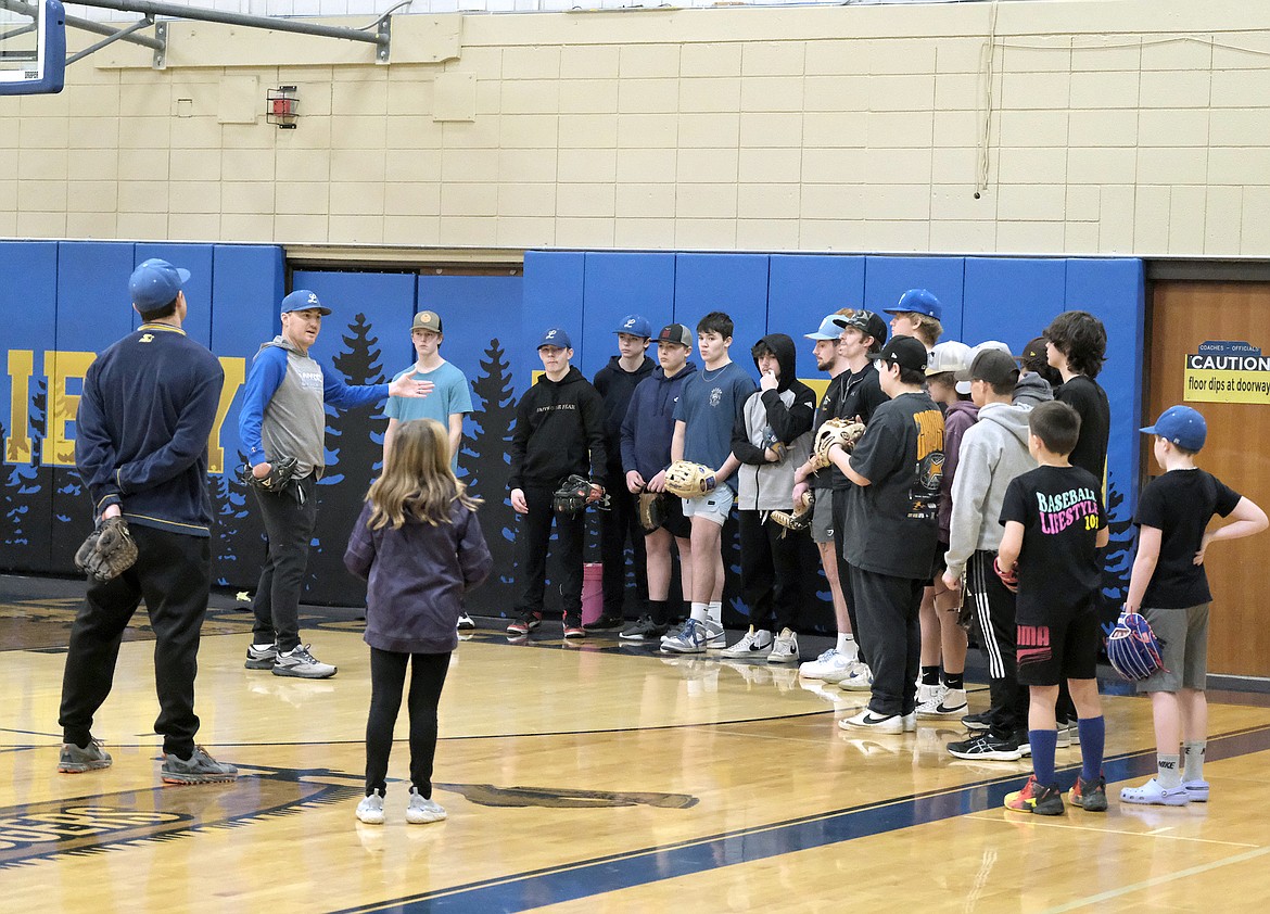 Libby Loggers Legion baseball coach Kelly Morford shares some pointers during the opening practice on Feb. 25 at the high school. (Paul Sievers/The Western News)