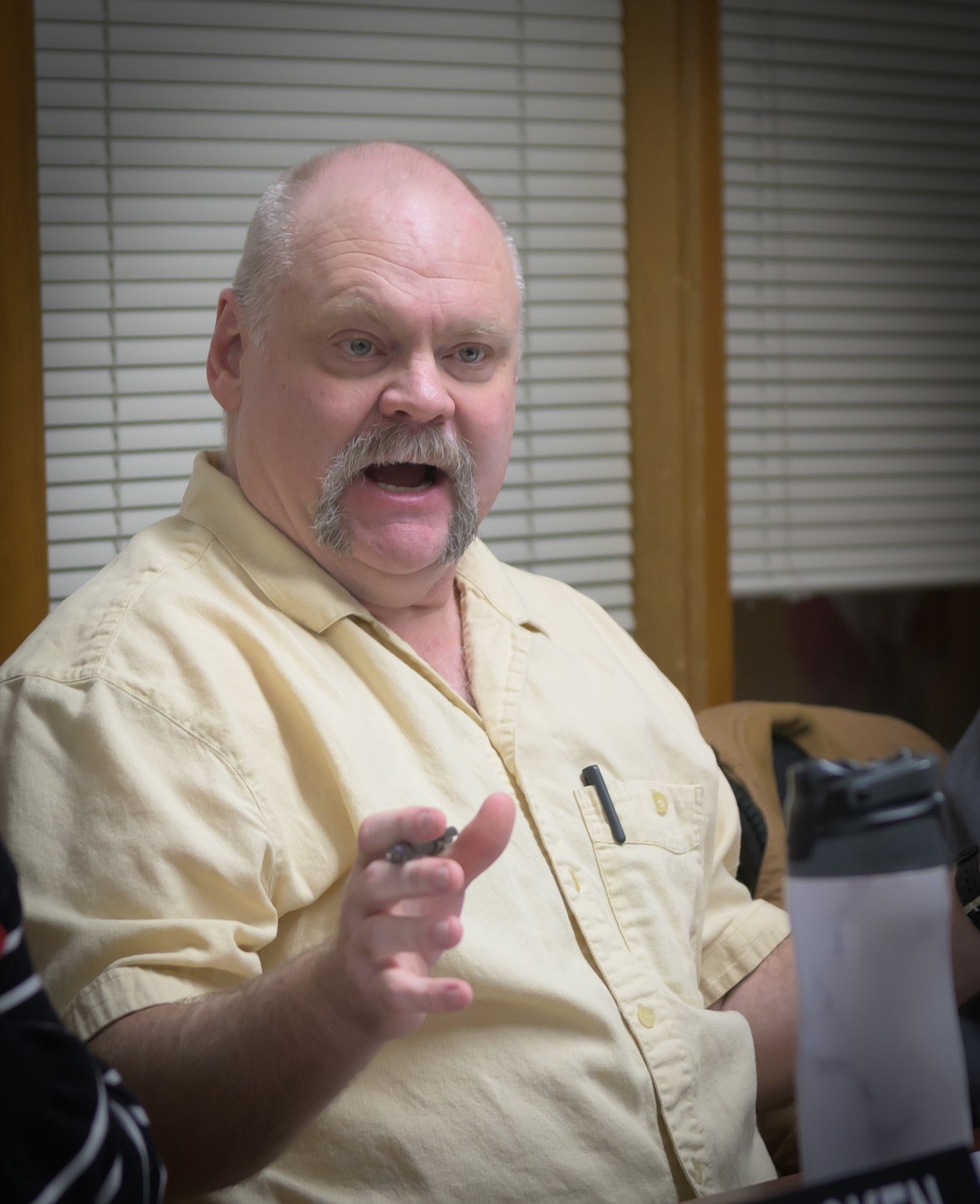 Ward 3 Councilor Chad Cantrell reviews a billing ordinance during the Plains City Council meeting. (Tracy Scott/Valley Press)