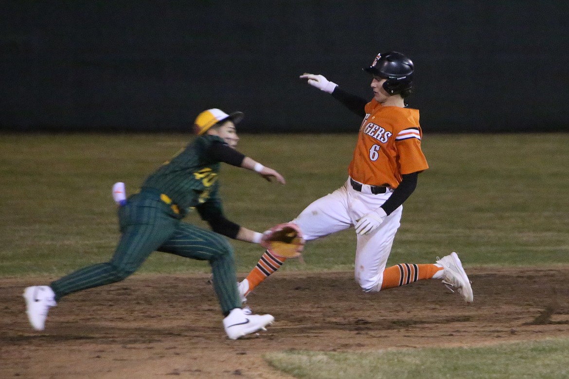 Ephrata sophomore Brady Hendrick (6) starts his slide into second base during Saturday’s game against Quincy.