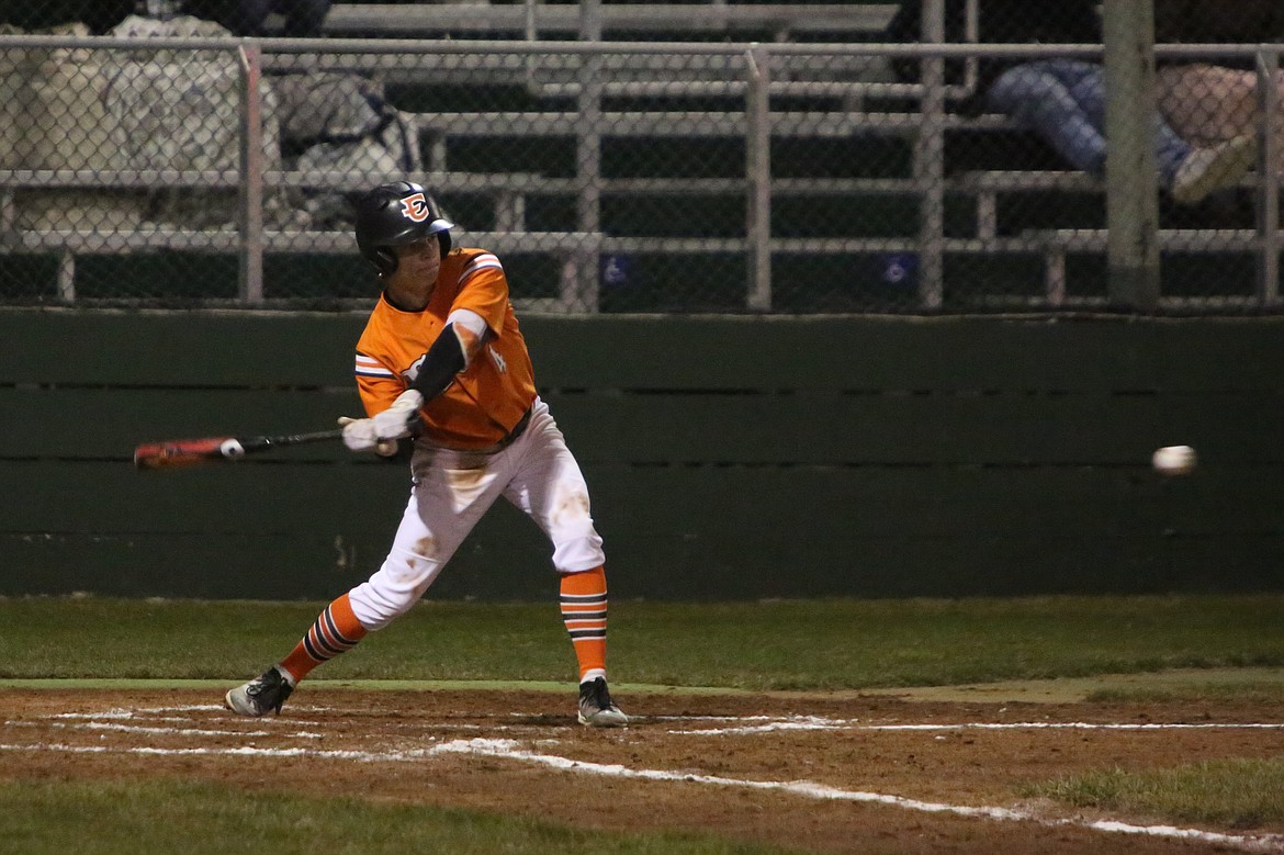 Ephrata senior Walker Fulk swings at an incoming pitch Saturday night against Quincy.