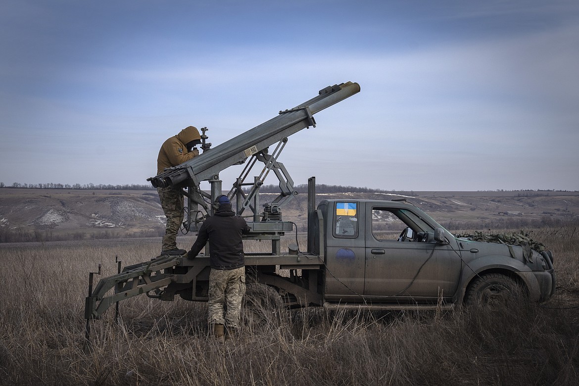 Ukrainian soldiers from The 56th Separate Motorized Infantry Mariupol Brigade prepare to fire a multiple launch rocket system based on a pickup truck towards Russian positions at the front line, near Bakhmut, Donetsk region, Ukraine, March 5, 2024. Senior U.S. defense officials said Tuesday, March 12, that the Pentagon will rush about $300 million in weapons to Ukraine after finding some cost savings in its contracts, even though the military remains deeply overdrawn. (AP Photo/Efrem Lukatsky, File)