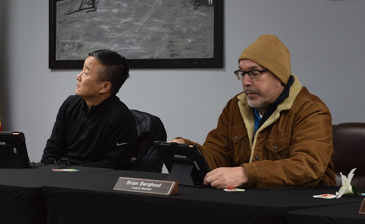 Council members Sun Hwang, left, and Brian Berghout, right, listen to a presentation during a January city council meeting at Mattawa City Hall. Berghout and Hwang both supported the adoption of new codes regarding the designation of potentially dangerous dogs during Thursday’s regular meeting.