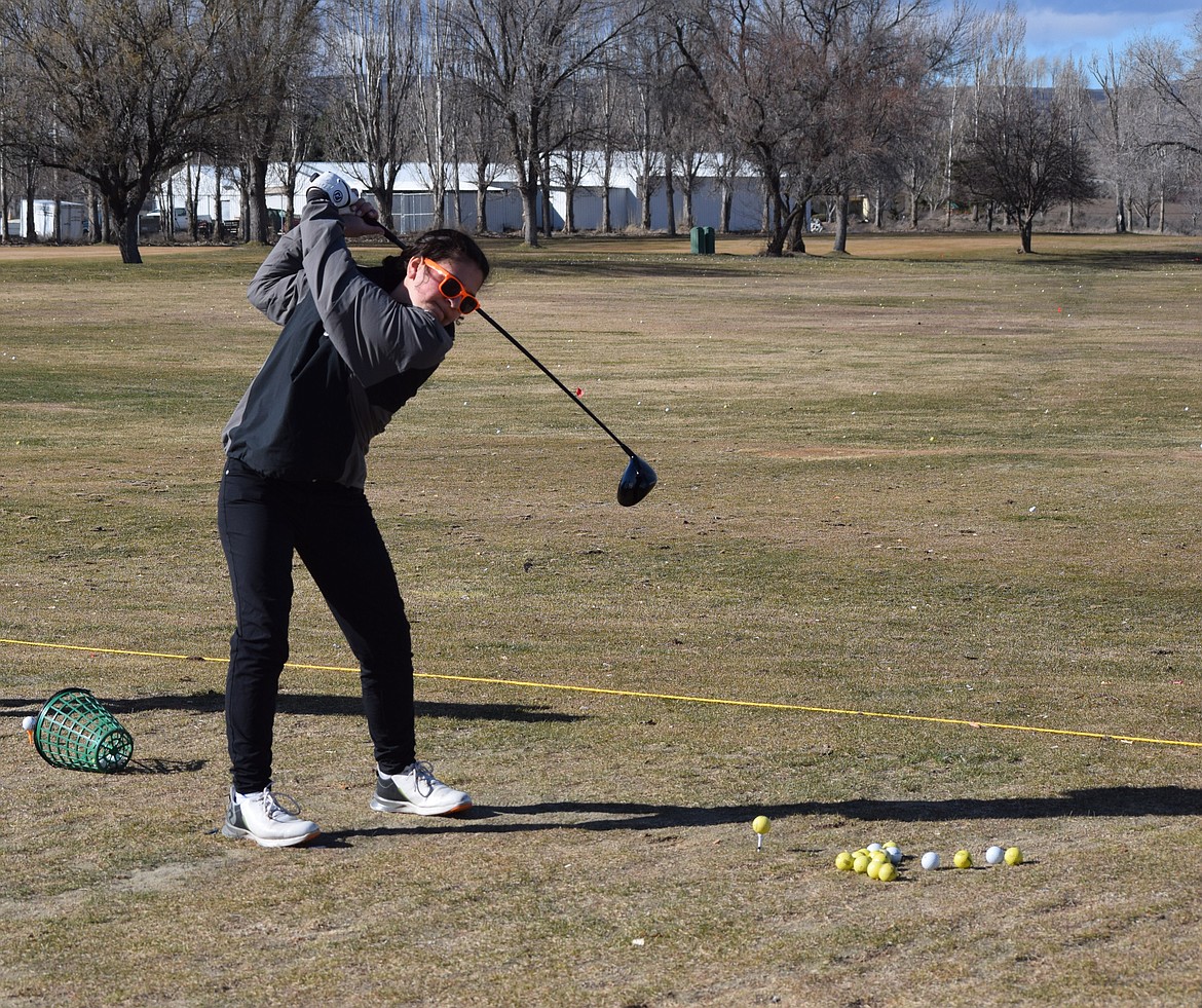 Ephrata’s Rayn Castillo in full backswing as she maintains focus on the ball during practice at the driving range Tuesday afternoon. Castillo shows a lot of talent, her coach said, and is likely to do well this year.