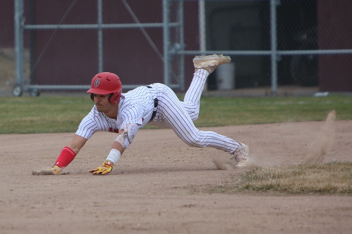 Othello junior Sonny Salazar III slides into second base.