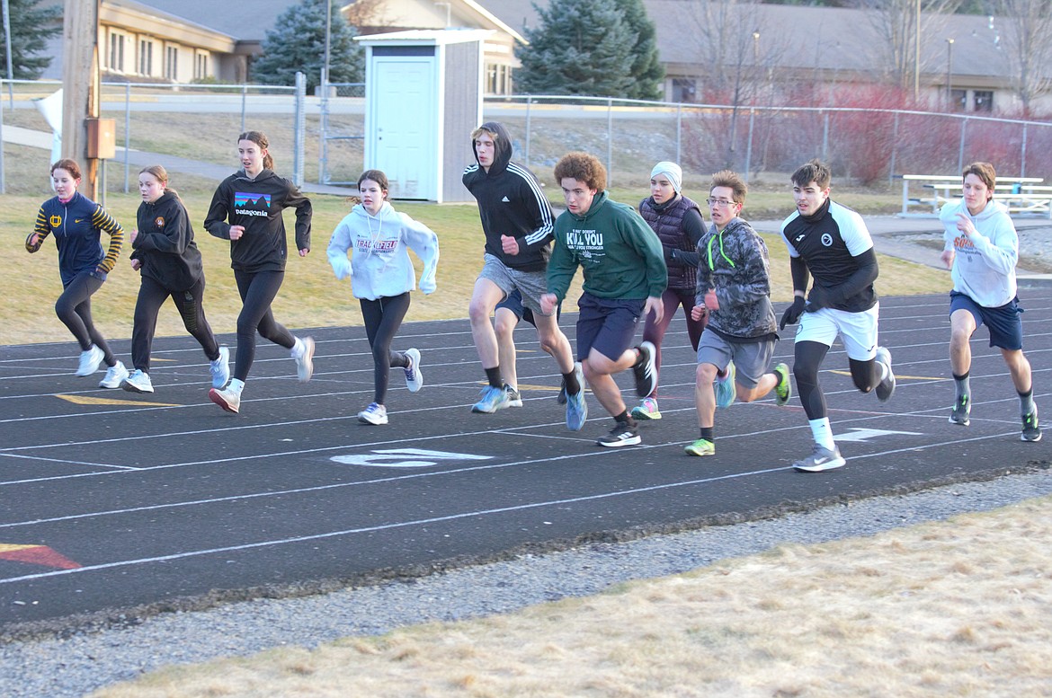 BFHS Track long distance runners work on running form.