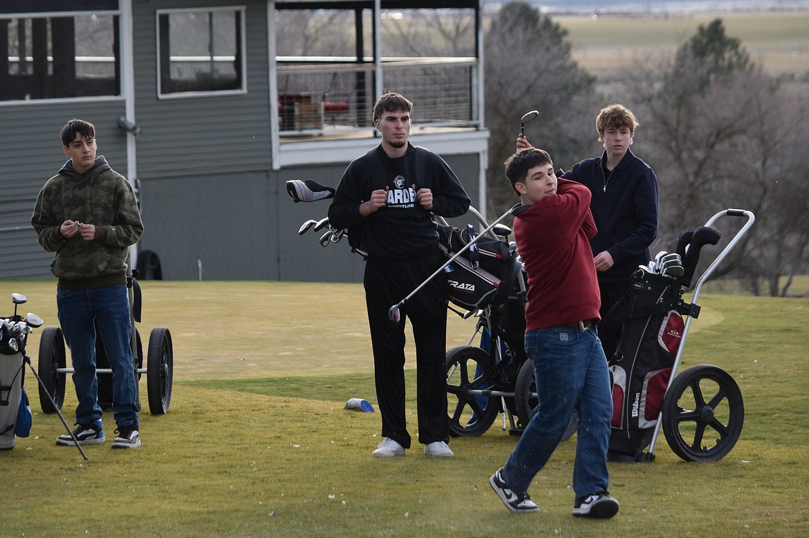 Members of the Warden Boys Golf team begin at the first hole at Sage Hills Golf Club during a regular practice Friday evening.