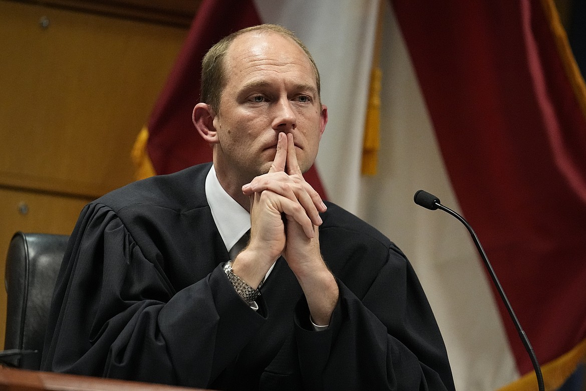 Fulton County Superior Judge Scott McAfee presides in court, Feb. 27, 2024, in Atlanta. The judge overseeing the Georgia election interference case has dismissed some of the charges against ex-President Donald Trump, but others remain. Judge McAfee wrote Wednesday in an order that six of the charges in the indictment must be quashed, including three against Trump. (AP Photo/Brynn Anderson, Pool, File)