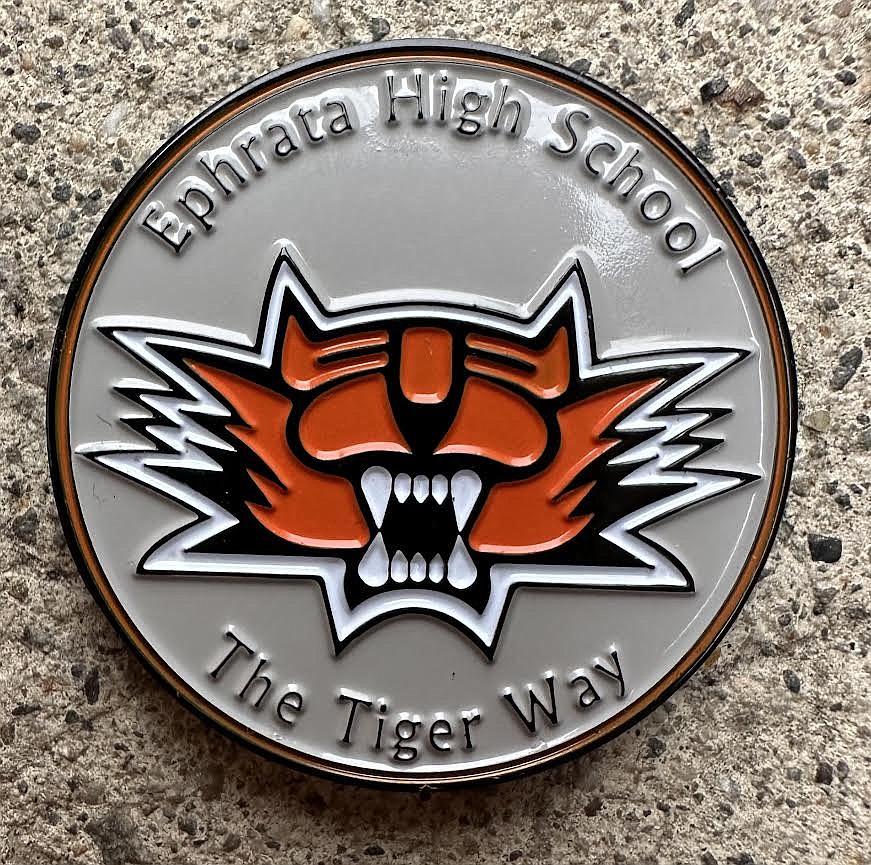 Since the program began in 2019, the Ephrata High School Challenge Coin has been presented to 18 recipients. EHS senior Ben Belino received the challenge coin after his recovery from a car accident that led to the loss of his left leg, coming back and winning five state championships in track and field and cross country.