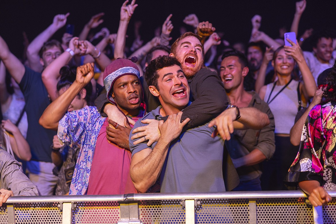 This image released by Amazon Prime shows, from left, Jermaine Fowler, Zac Efron and Andrew Santino in a scene from "Ricky Stanicky."