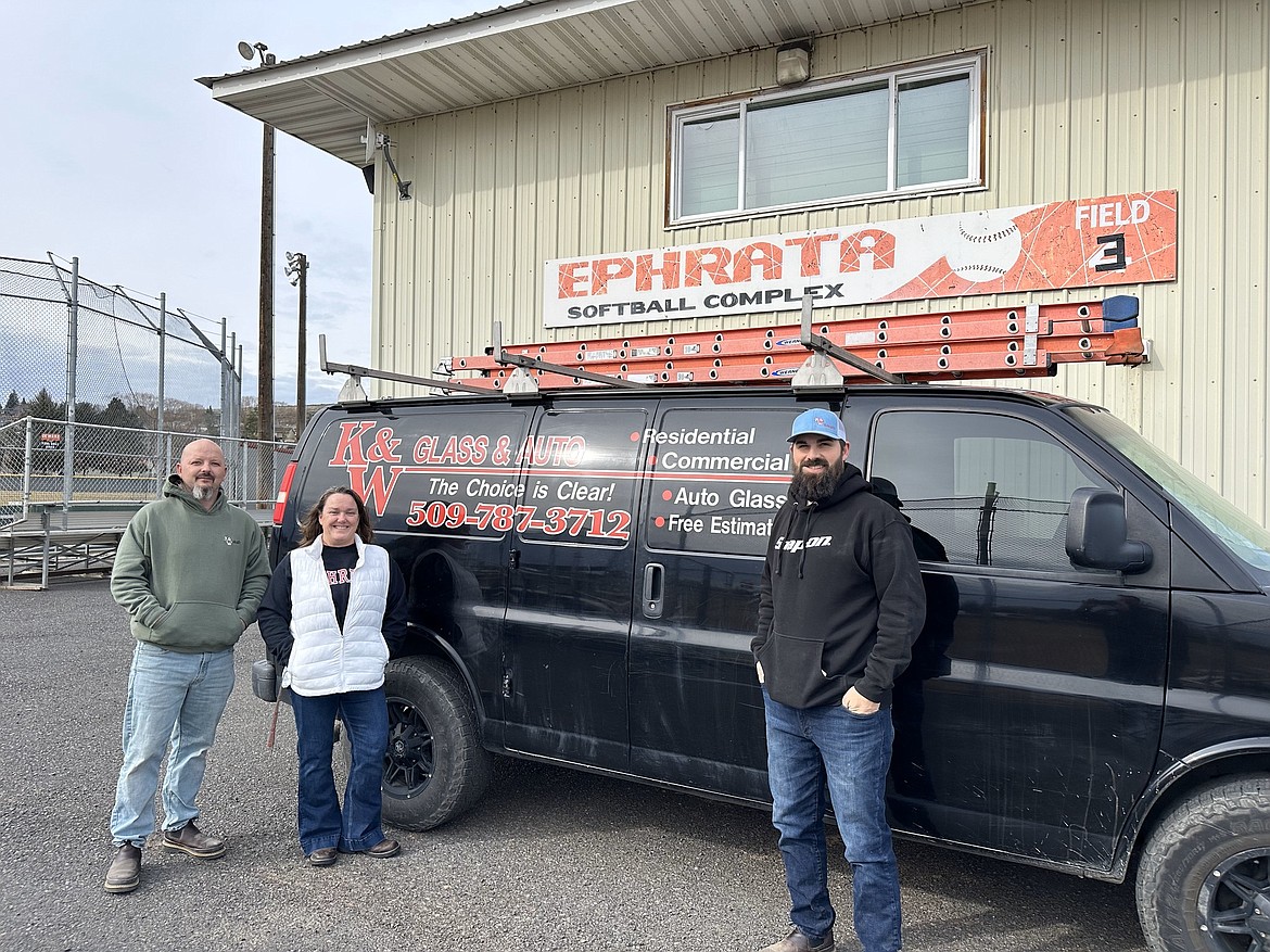 Staff with M&H Glass in Ephrata stand in front of the building where they installed windows at the Ephrata High School Softball Complex.