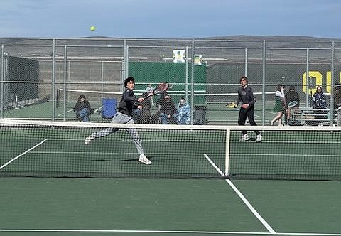 Jett Julian and Mitch Morford play a doubles match against Quincy on Saturday. Coach Courtney Burck said the pair played well together that day.