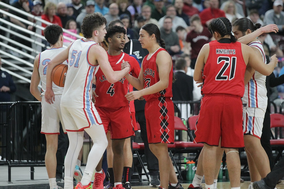 MARK NELKE/Press
Players from Lakeside (red uniforms) and Lapwai congratulate each other at the end of the state 1A Division 1 high school boys basketball championship game March 2 at the Ford Idaho Center in Nampa.