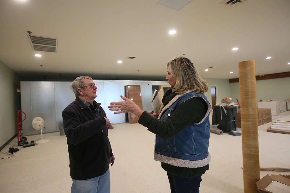 Kiwi Kirk, left, chats Wednesday morning with Leslie Orth during a tour of the soon-to-open Third Avenue Marketplace in Post Falls, where the food bank and senior center will combine and operate under one nonprofit. “We are so excited,” Orth said. “It’s surreal, it really is. We’ve needed this for so long.”