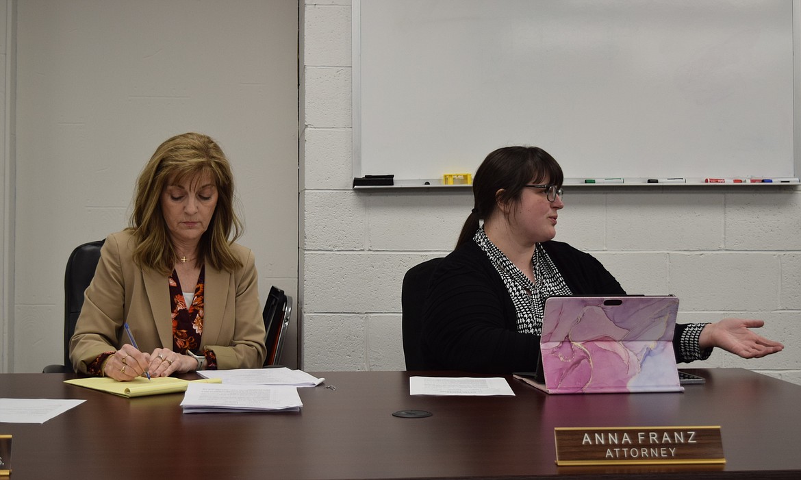 Warden City Administrator Kriss Schuler, left, and City Attorney Anna Franz, right, participate in council discussion during Tuesday evening’s Warden City Council meeting at Warden Police Station.