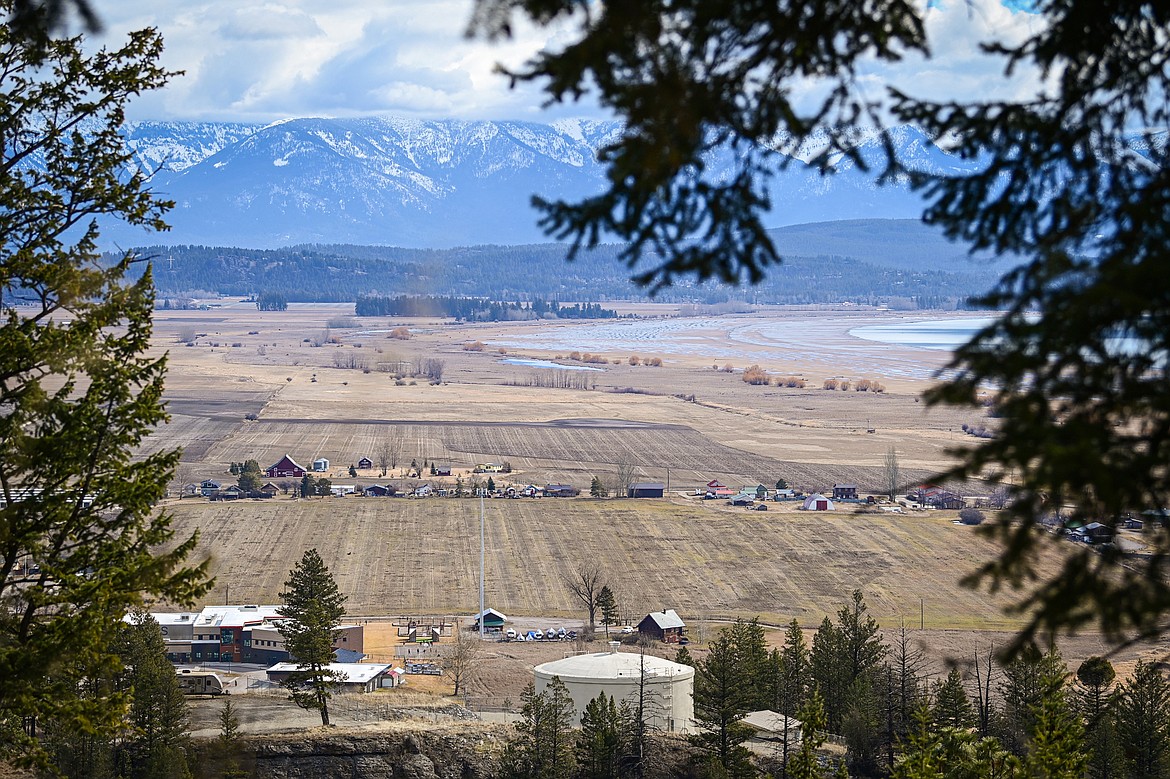 A view over a 63.79-acre plot of land behind Somers Middle School, bottom left, the site of the proposed Steamboat Landing subdivision project in Somers on Thursday, March 14. (Casey Kreider/Daily Inter Lake)