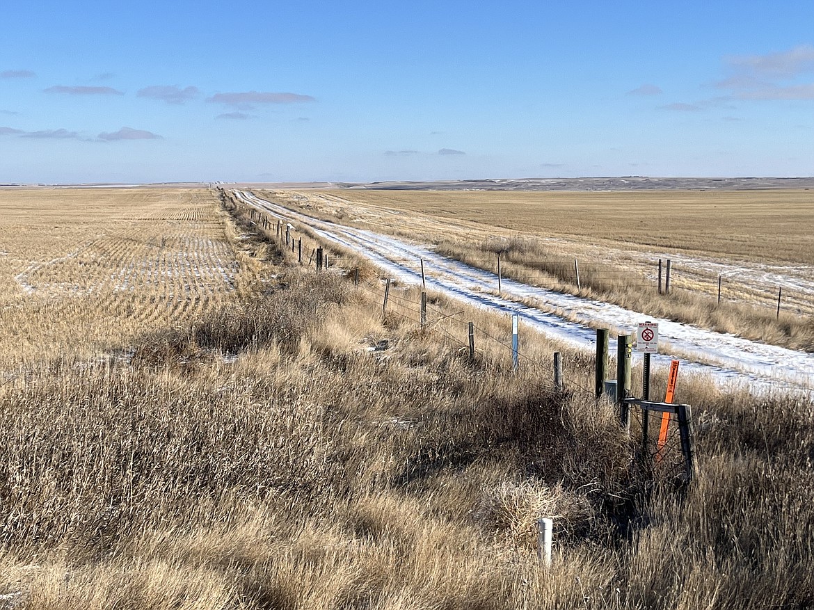 The vertical white cylinder is one of many that Amy Yoder with the Sheridan County Conservation District checks throughout the growing season. She opens up the top, connects the data logger inside to a laptop and collects information on the aquifer water level and how much water has been used for irrigation. (Photo courtesy of Keely Larson)