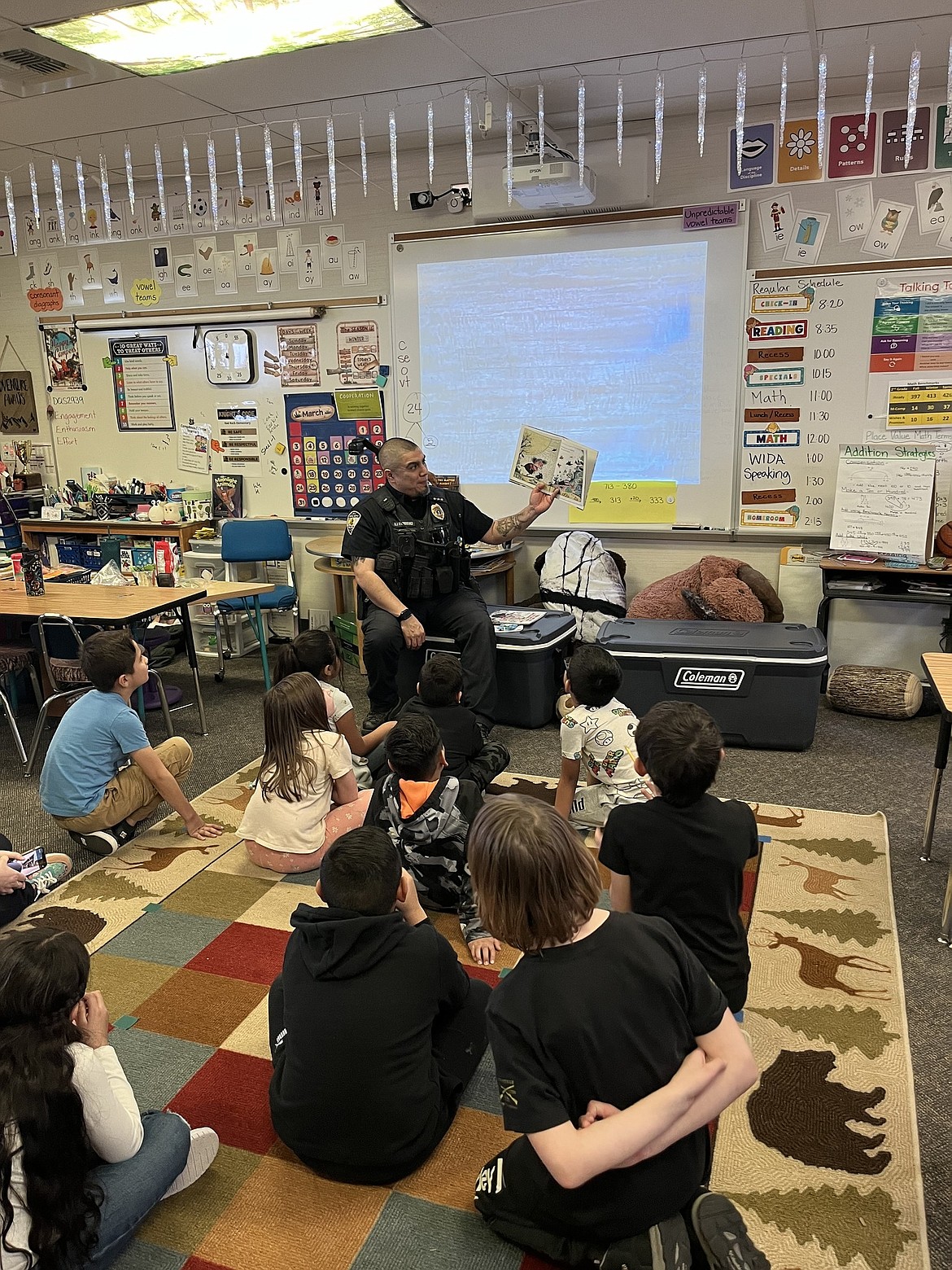 Royal City Police Chief Rey Rodriguez reads to students at Red Rock Elementary School in Royal City last week as part of Read Across America.