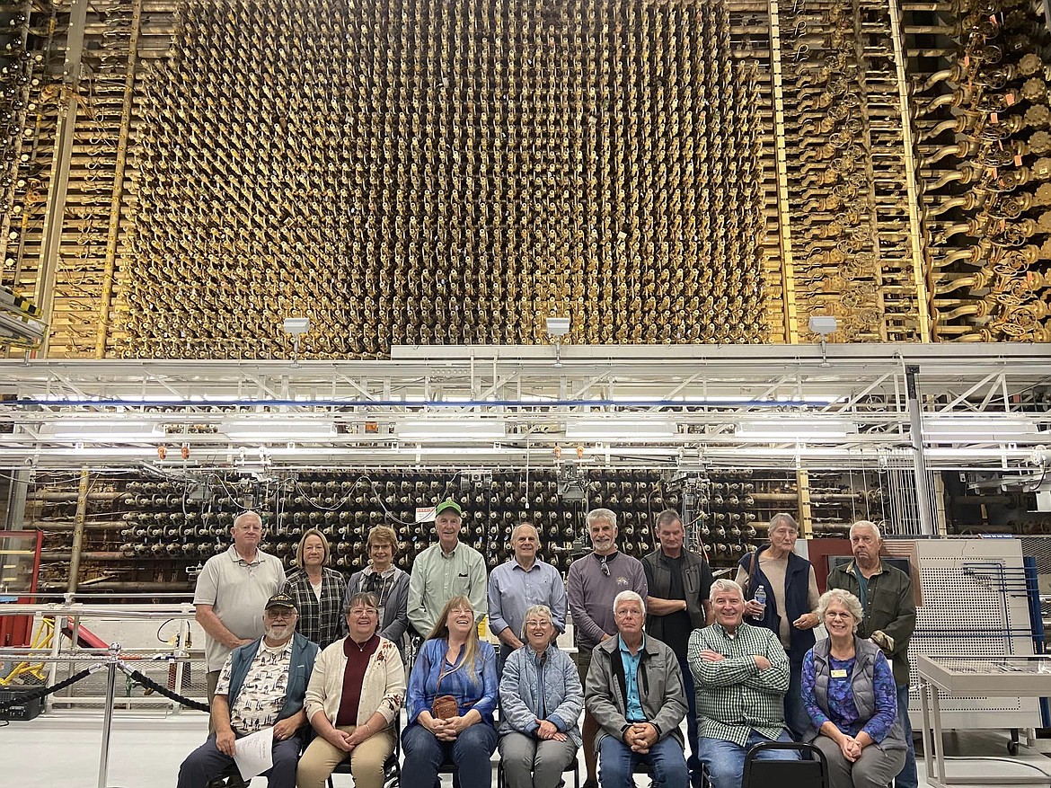 Quincy Valley Historical Society & Museum tour participants stop for a picture with the original Hanford nuclear reactor in 2023. The museum is sponsoring a whole new series of tours and lectures in 2024.