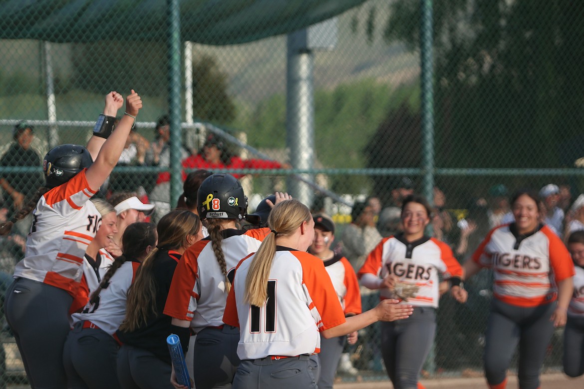 Ephrata teammates celebrate after a home run against East Valley (Yakima) in the 2023 season.
