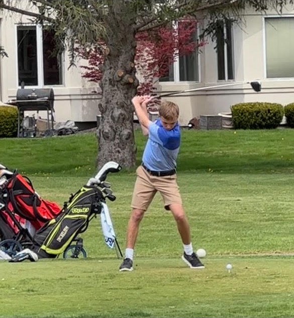 Almira/Coulee-Hartline junior Jack Molitor swings his club on the tee box. Molitor is one of two Warriors returning with postseason experience.