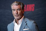 Pierce Brosnan pleads guilty to walking off trail at Yellowstone hot springs, must pay $1,500