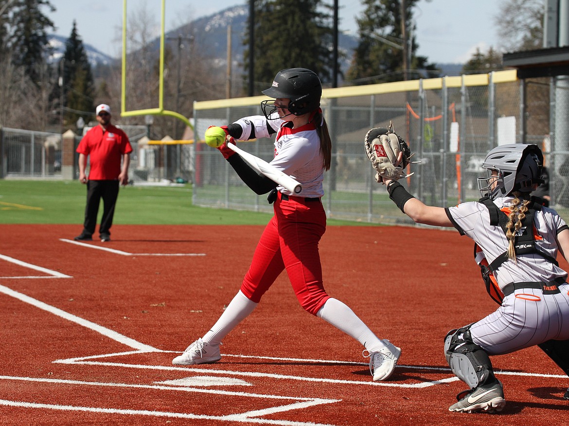 Sandpoint's Cadence Skibitsky hits a line drive for a single in a game against Post Falls last season at War Memorial Field.