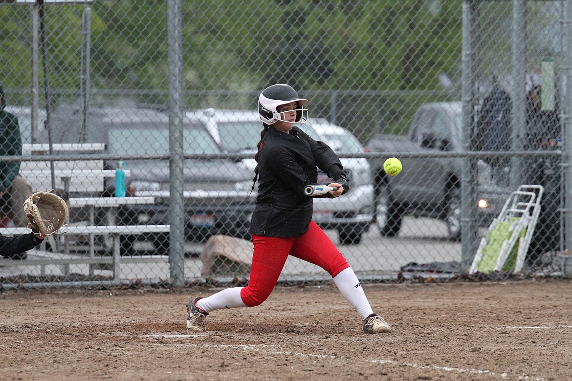 Sandpoint's Kaylee McCown rips a single to center-right field in a game against Lakeland last season.