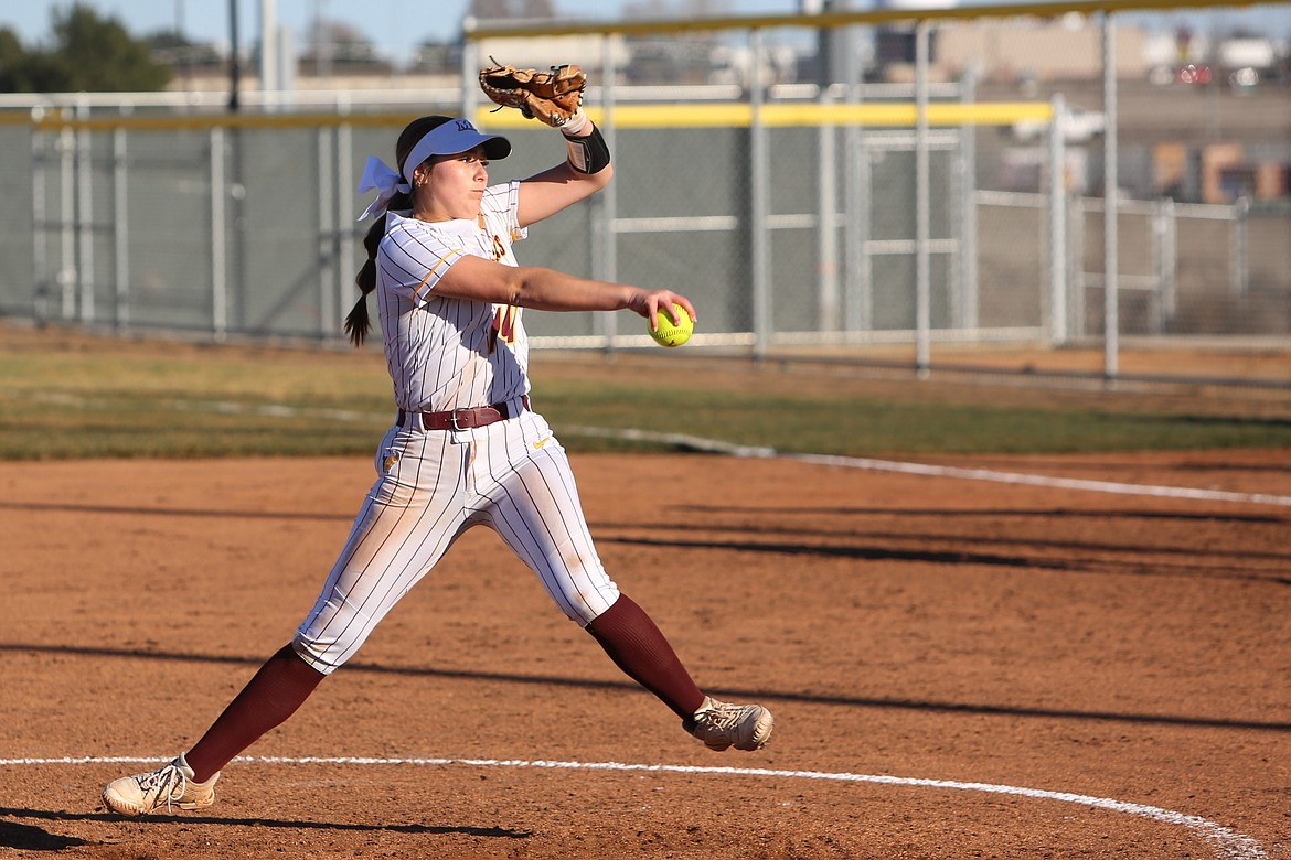 Moses Lake junior Paige Richardson pitches the ball to Mt. Spokane.