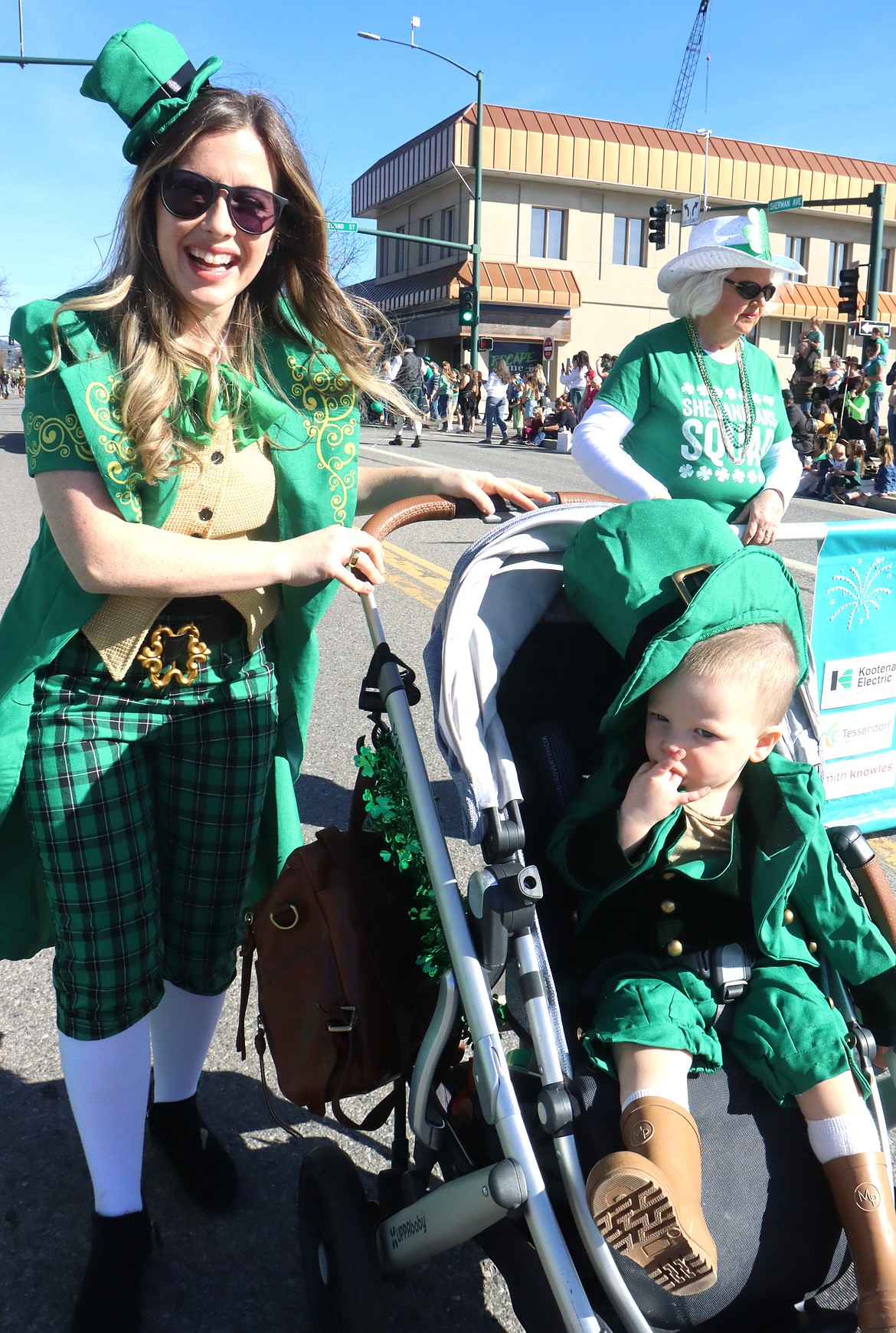 Katie Terra pushes son Wells in his stroller during the St. Patrick's Day Parade on Saturday.