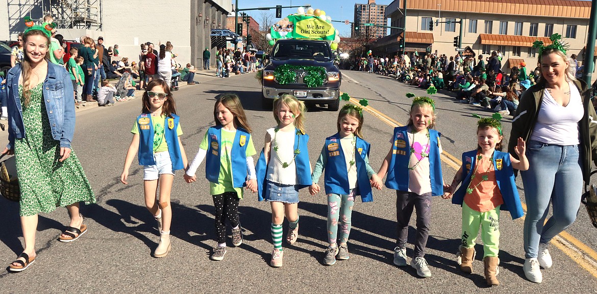 Girl Scouts walk the St. Patrick's Day Parade on Saturday.