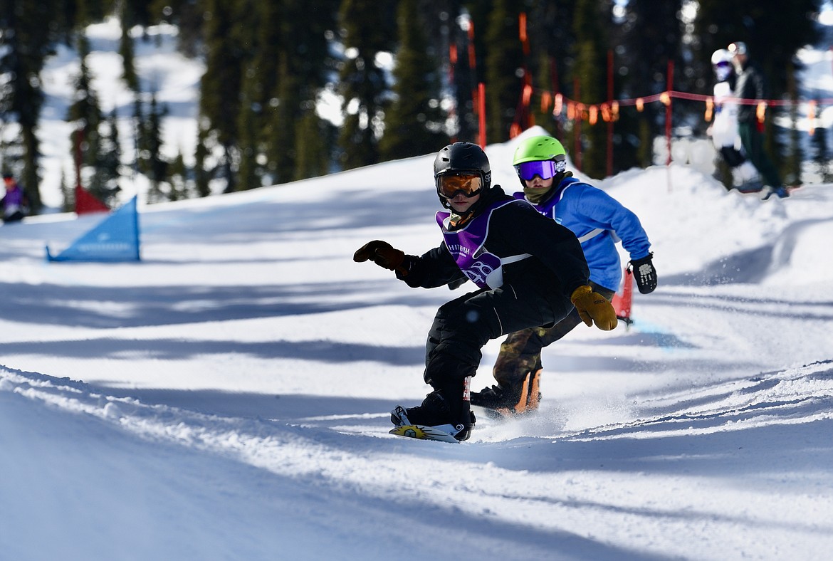 Snowboarders compete in the Nate Chute boardercross races at Whitefish Mountain Resort on Sunday, March 17, 2024. (Matt Baldwin/Whitefish Pilot)