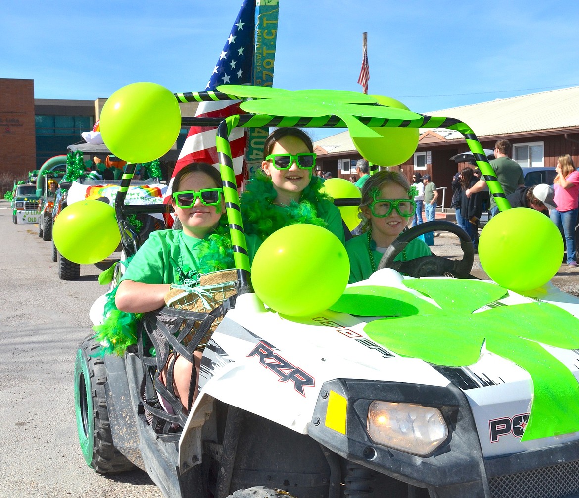 NEON GREEN drivers piloted a RZR through Ronan Sunday. (Kristi Niemeyer/Leader)