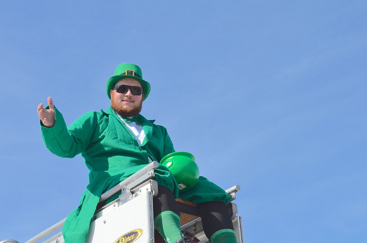 The usual array of emergency vehicles brought up the end of Ronan's St. Patrick's Day Parade, with a leprechaun straddling the ladder truck. (Kristi Niemeyer/Leader)