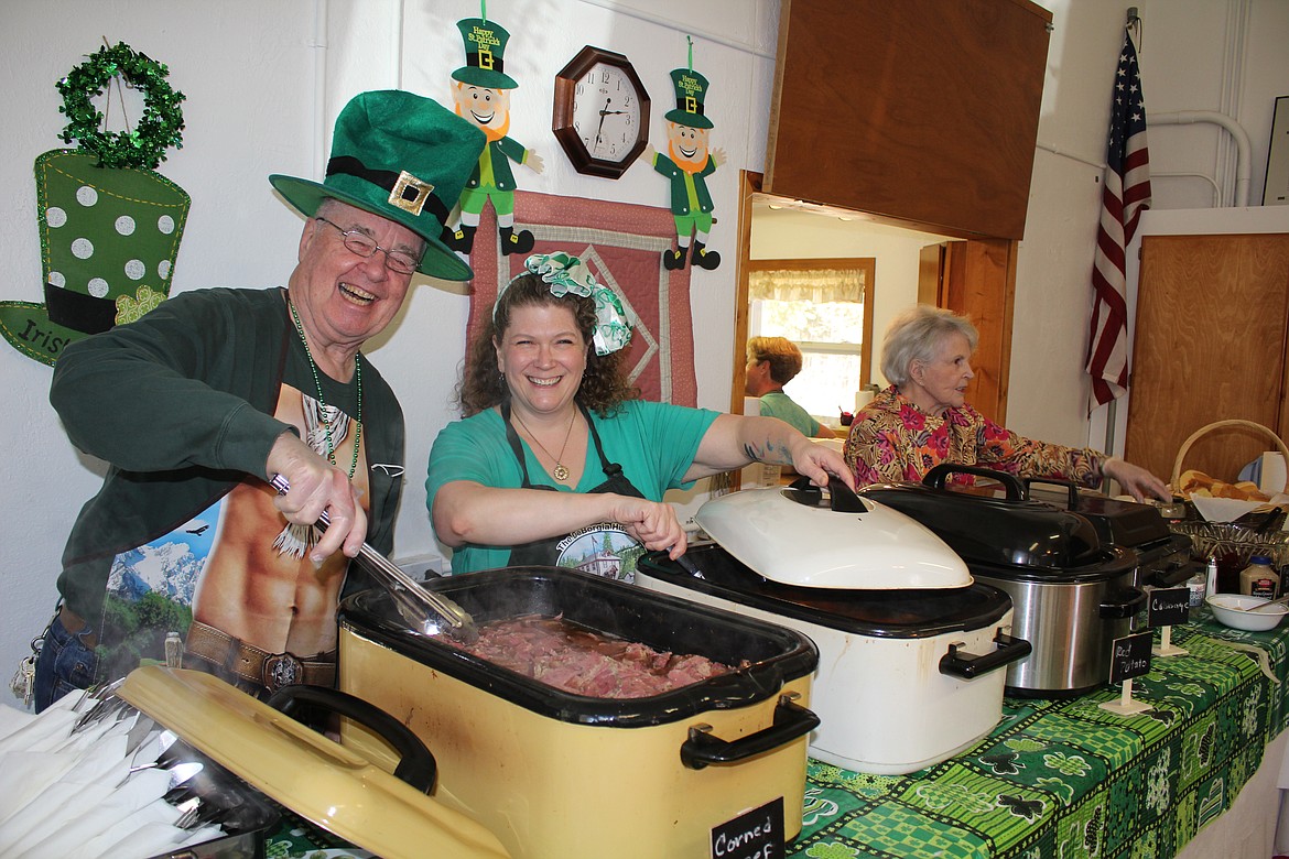 The spirit of St. Patrick was in the serving line at the Old DeBorgia School on Sunday as corned beef, cabbage, spuds and carrots were generously heaped onto plates. (Monte Turner/Mineral Independent)