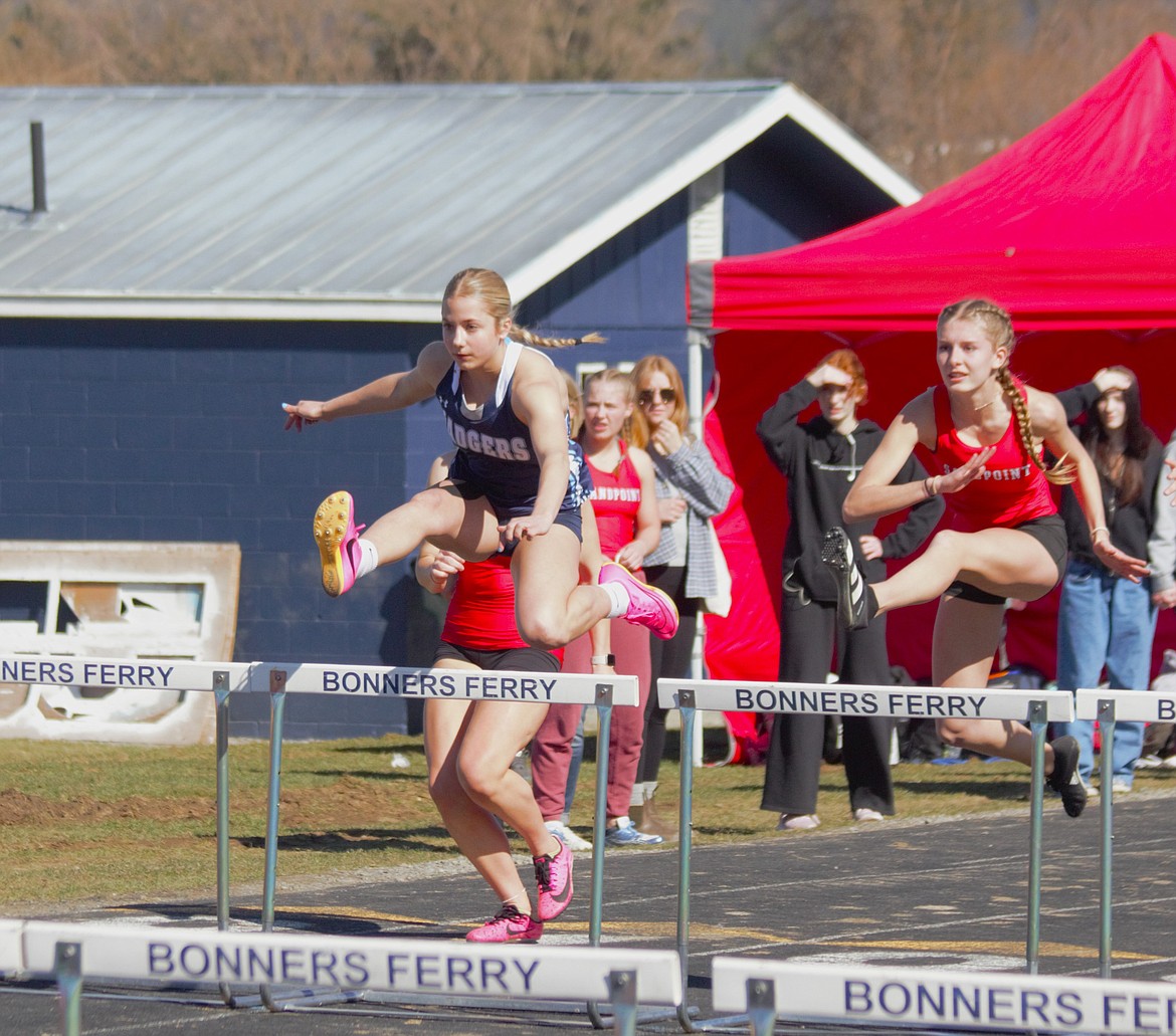 (left) Ireland Grady takes first in the 100m hurdles for the Badgers at the Bonners Ferry Invite and season opener on March. 16.