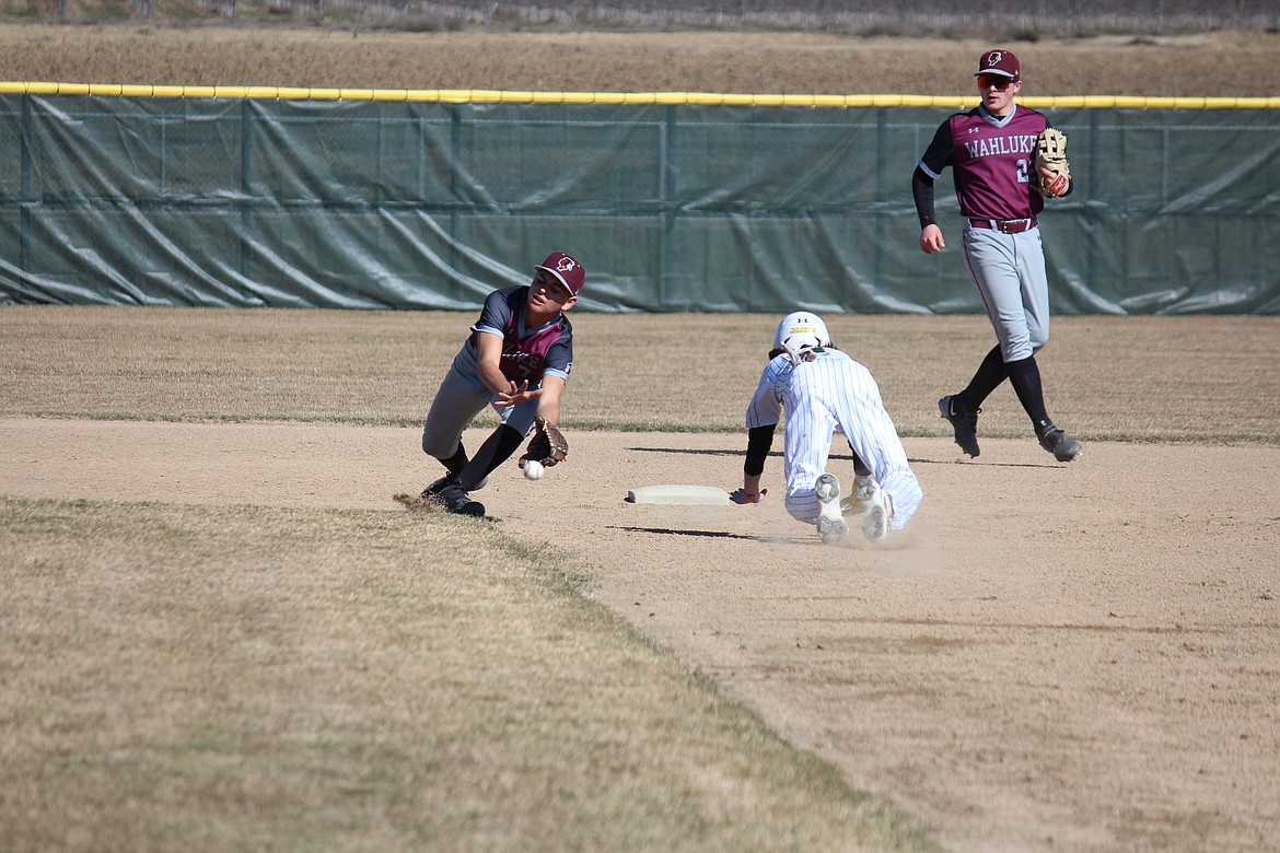 A Quincy baserunner steals second during the Jacks’ game with Wahluke Saturday. Quincy coach Seth Longwill credited aggressive baserunning as a factor in Quincy sweeping the doubleheader.