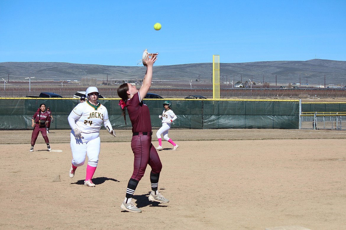 Wahluke’s Madi Harlow catches a pop-up near third base in the Warriors’ game with Quincy Saturday.