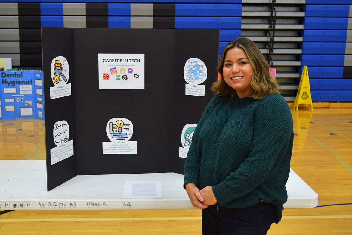 Warden High School alum Cassondra Martinez, now a product manager for Instagram, stands in front of her presentation board for the networking session during Thursday’s STEM day, where she spoke to students about her experiences as a STEM professional.