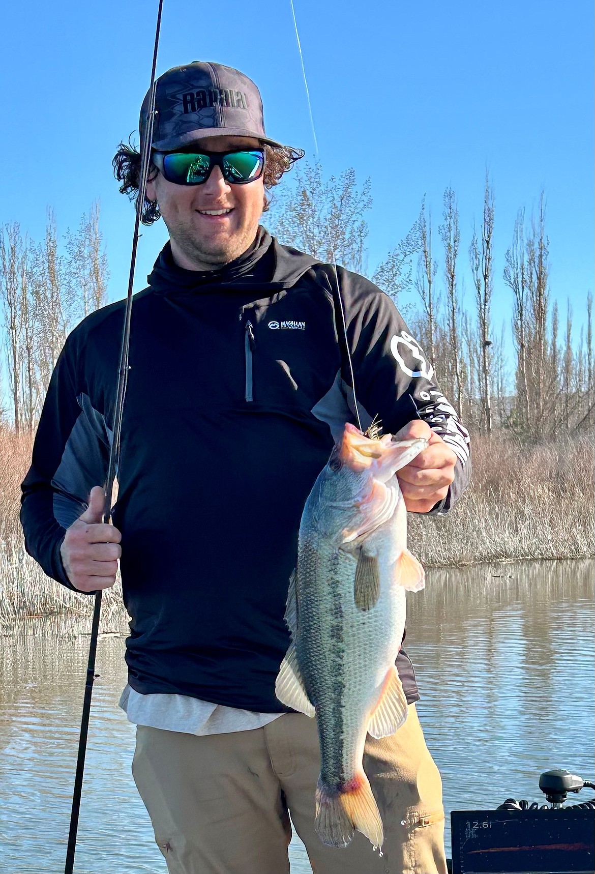 Local angler Evan Quillin shows a nice spring bass caught while fishing Potholes Reservoir.