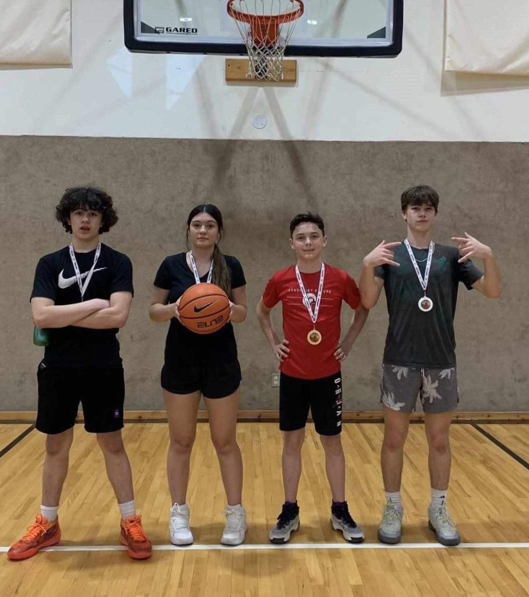 From left, Jason Mayorga, Kiylah Anderson, Mason Martz, and Justice Keyser won the 3-on-3 tournament's high school division on Sunday.