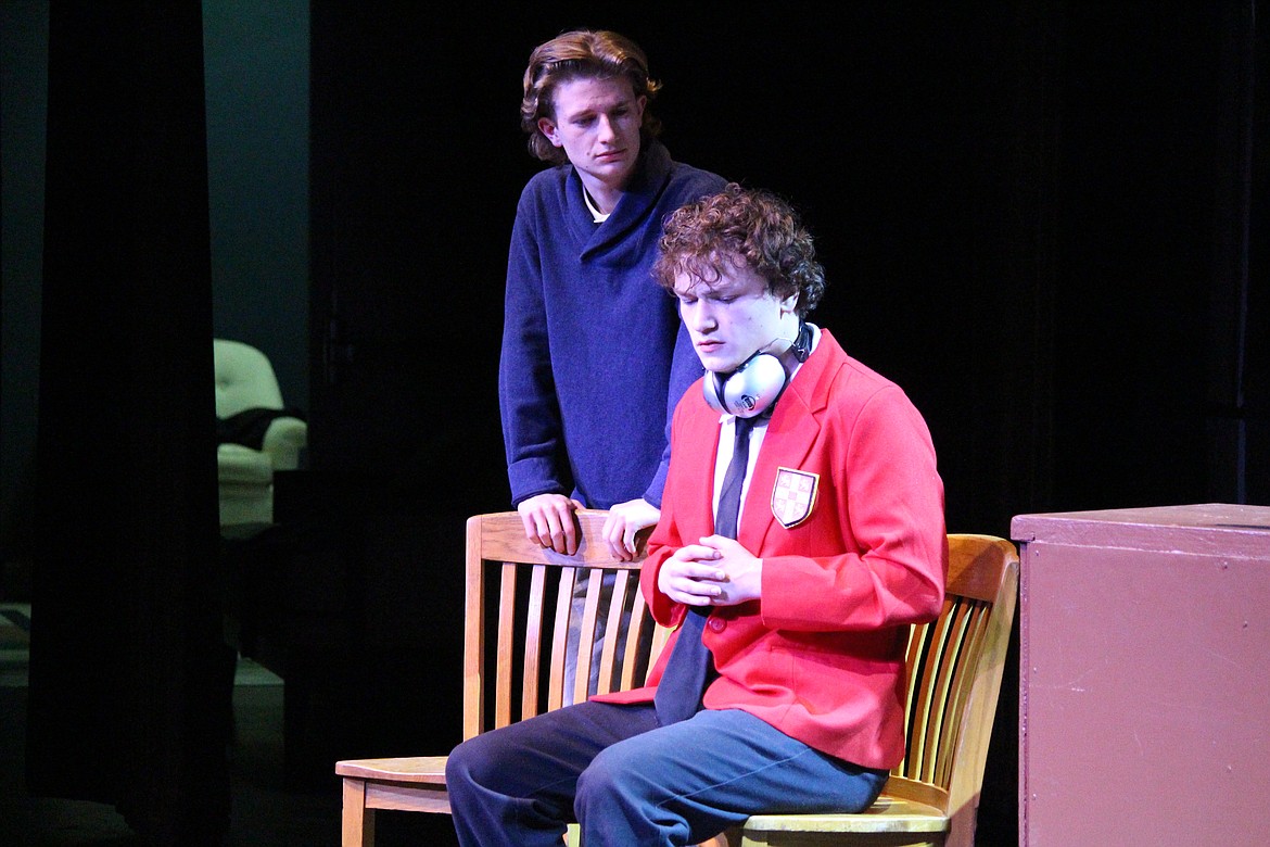 Christopher (Noah Carlile), right, must make a promise to his dad (Beck Ashton), left, in the Moses Lake High School production of “The Curious Incident of the Dog in the Night-time.” The drama club brought home the highest award from the state drama festival for its performance of scenes from the play.