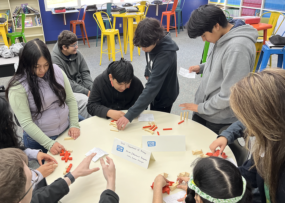 Wahluke Junior High eighth-grade science students solve brain teasers while guest engineers from the Hanford Nuclear Site talk about their backgrounds, education and careers during their visit to the school March 15.