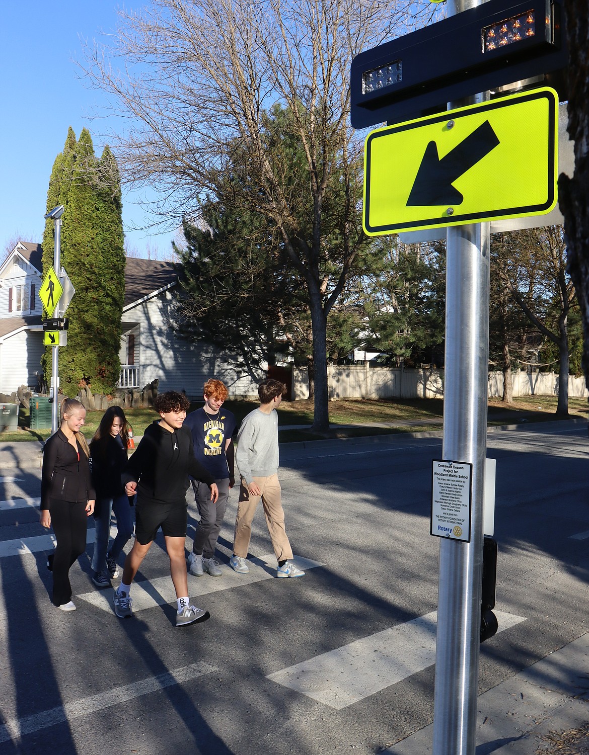 Woodland Middle School students cross at St. Michelle Drive using the new rapid flashing beacons Tuesday.