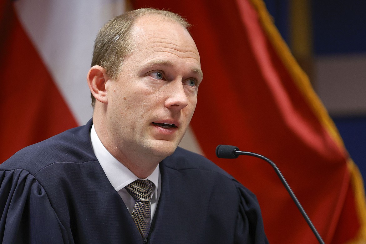 Fulton County Superior Judge Scott McAfee presides over a hearing is to determine whether Fulton County District Attorney Fani Willis should be removed from the case because of a relationship with Nathan Wade, special prosecutor she hired in the election interference case against former President Donald Trump, Friday, March, 1, 2024, in Atlanta. Scott McAfee, who's presiding over the election interference case, drew two challengers Friday, March 8, 2024, for his nonpartisan race in May: civil rights attorney Robert Patillo and Tiffani Johnson, a staff attorney for another Fulton County judge. (AP Photo/Alex Slitz, Pool, File)