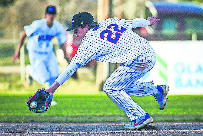 REGGIE SAPA of Columbia Falls backhands a grounder during a baseball game last April. The Wildcats made a statement with an 18-10 win over defending champion Polson on Tuesday. (Casey Kreider/Daily Inter Lake)