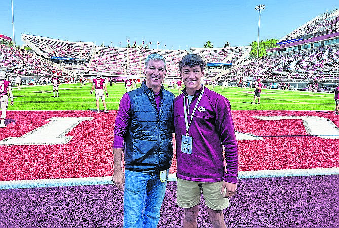 RYDER BARINOWSKI, right, stands with former NFL kicker Matt Stover before a Montana Grizzlies football game last fall. (photo courtesy of Bear Barinowski)