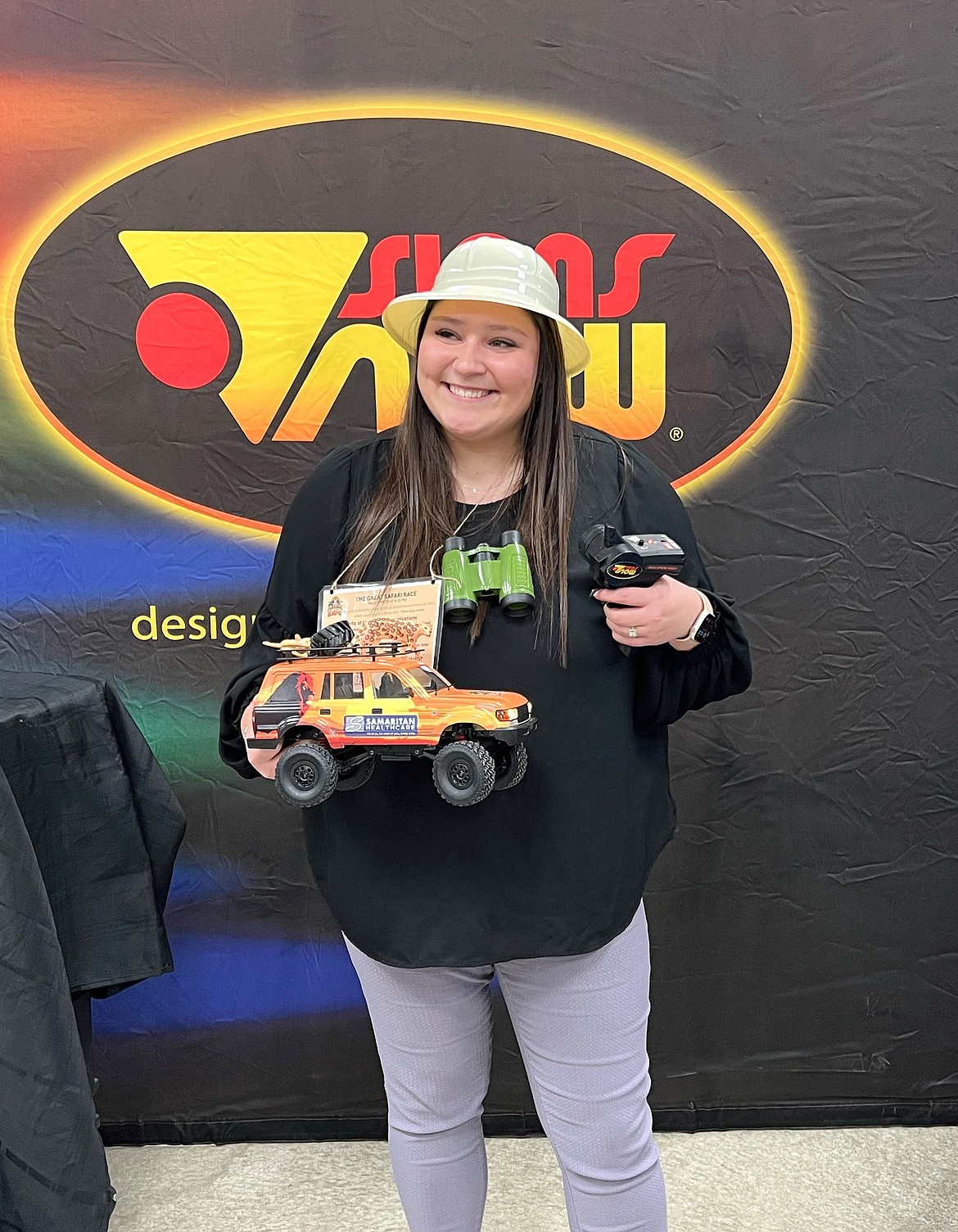 Brooke Richardson won the radio-controlled car race, which sent tiny vehicles and their drivers dashing through the crowds at the Business Expo Tuesday.