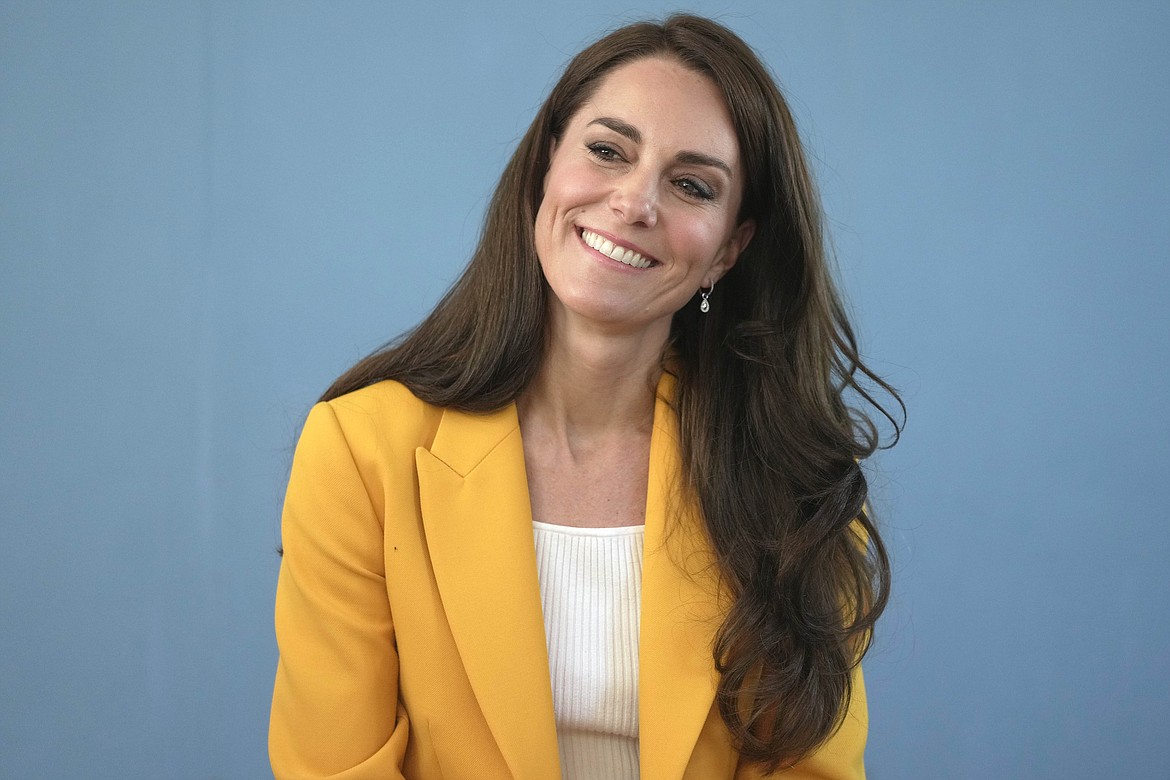 Britain's Kate, Princess of Wales, smiles as she visits the Dame Kelly Holmes Trust and meets with some of the young people that the charity supports, May 16, 2023, in Bath, England. (AP Photo/Kin Cheung, Pool, File)